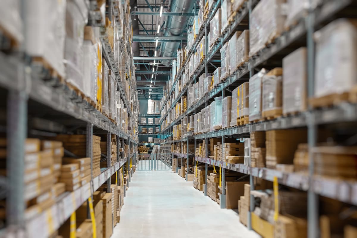Interior of a warehouse with stacked boxes on shelves